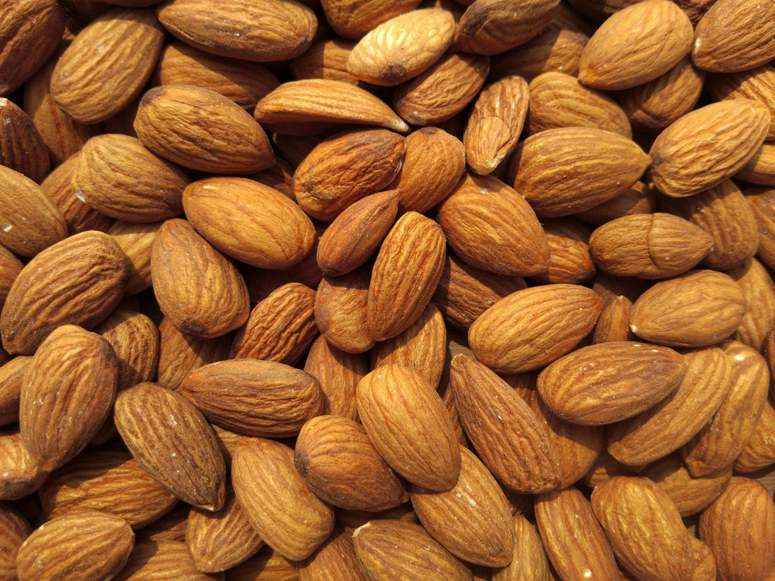 Almond oil has many skin benefits and is used for SportSKN skincare, photo by Avinash Kumar on Unsplash